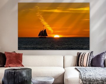 USA, Florida, Ancient sailing boat next to fantastic orange sunset by adventure-photos