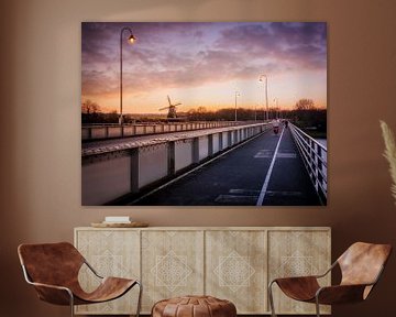 The Wilhelmina bridge in Deventer and the bolwerkersmolen in the evening by Bart Ros