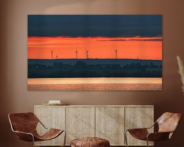 Wind turbines on an island at sunset by Martin Köbsch