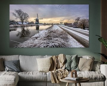Reflections of tree and mill in winter
