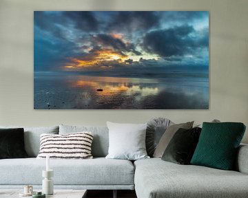 Threatening clouds and setting sun over the North Sea on the North Holland coast by Bram Lubbers