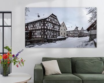 Herleshausen vakwerkhuizen in de winter van Roland Brack