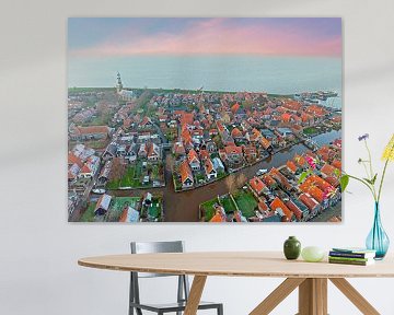 Luchtfoto van Hindeloopen in de winter aan het IJsselmeer in Nederland bij zonsondergang van Eye on You