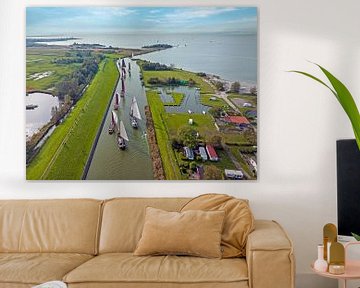 Aerial view of the sailing race the Workumer Strontrace with traditional old boats near Workum in the Netherlands by Eye on You