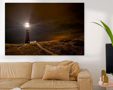 Lighthouse and fishermen's cottages in the night at the island of Schiermonnikoog