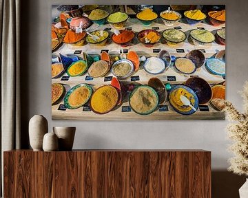 Colourful spices in tagine by Blond Beeld