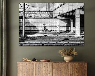 Cyclist between two train viaducts in Amsterdam by Jan Willem de Groot Photography