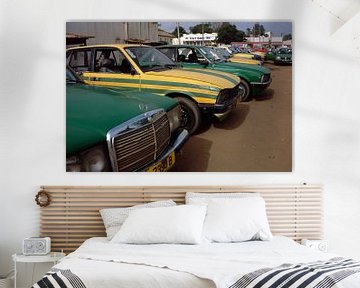 Bakau Gambia Taxi Rank with Mercedes and Peugeot. by Richard Wareham