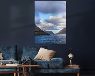 View of the rocks of the Faroe Islands with clouds by Rico Ködder