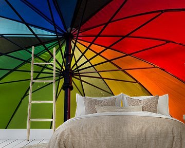 Under colourful umbrella