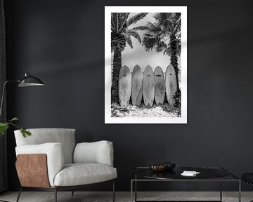 Surfboards on a palm beach in black and white by Felix Brönnimann