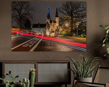 Driving past the Delft East Gate in the evening by Jeroen de Jongh