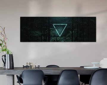 Luminous inverted neon triangle shape in front of tropical plants and trees by Besa Art