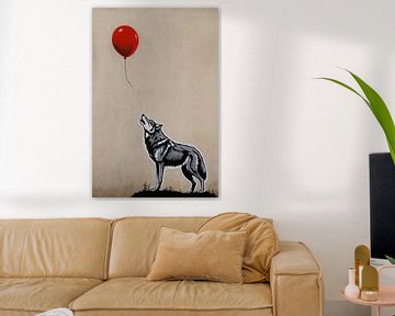 Le loup qui regarde et le ballon rouge volant sur De Muurdecoratie