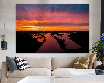 Amazing colorful sunset over the river IJssel