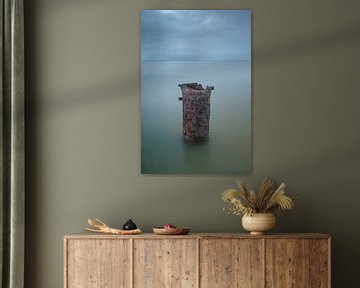 Rusty pole in the water, minimalist by Rick Goede