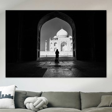 Silhouette of woman in gate opposite the Taj Mahal in Agra India. Wout Kok One2expose.