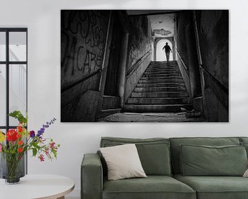 Silhouette of woman an the end of the stairs in a tunnel. Wout Kok One2expose by Wout Kok