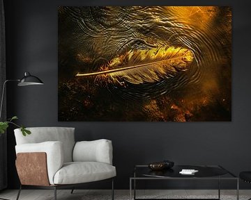 Golden feather floating on a watery sunset