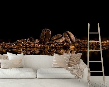 Drie koffiebonen op een rij