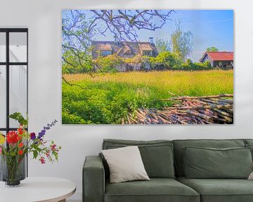 Boerderij tussen de lentebloemen en bomen van Jos van den berg