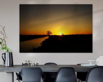 Zicht op Eemnes bij zonsondergang vanaf de Eempolder van Jos van den berg