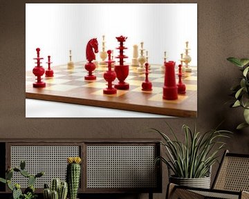 Chess board with red and white ivory pieces von Wim Stolwerk