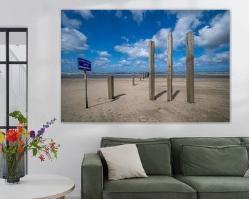 Beach poles at nude beach by Peter Bartelings