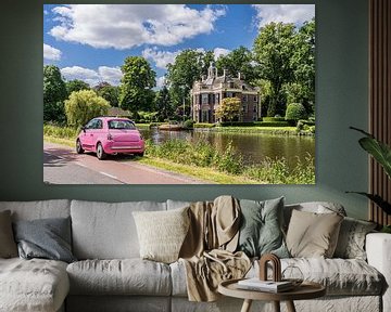 Pink Fiat 500 opposite a villa at the river Vecht