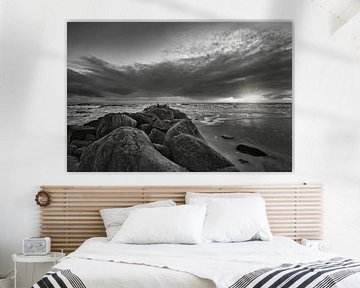 Large stones on the sandy beach at sunset in Denmark by Martin Köbsch