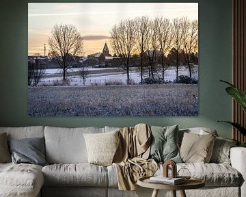 Winters landschap met uitzicht op een kerk van Mickéle Godderis