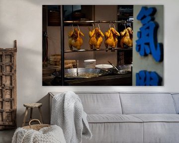 Chinese kitchen with chickens hanging from a rack by Mickéle Godderis