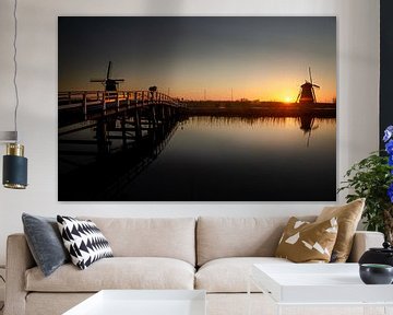 Fotograaf bij zonsopkomst in Kinderdijk van Jurrie Renskers