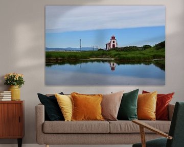 A small lighthouse on the banks of the river by Claude Laprise