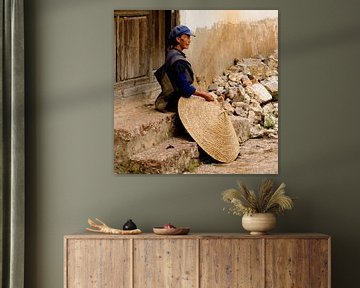 Woman with rice hat in China by Cindy Mulder