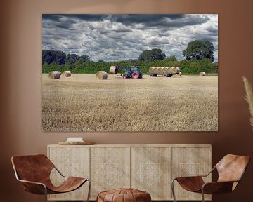 Driving in straw on the Lower Rhine before the rain comes by Peter Eckert
