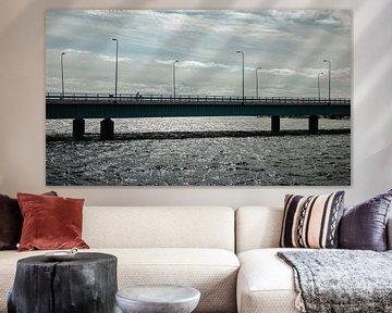 A cyclist on a bridge by Brave Toaster Photos
