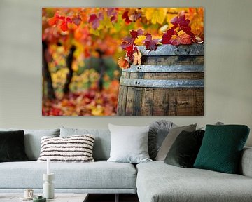 Wooden barrel with autumn leaves