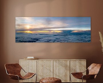 Zonsondergang boven de wolken van Denis Feiner