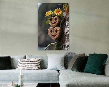 Two wooden hearts with yellow flowers