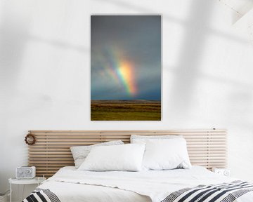Beautiful rainbow in the sky of Iceland with mountain and landsc
