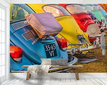 Row of classic Volkswagen Beetles by Martin Bergsma