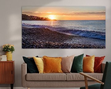 Sunrise on the beach at Menton in France by Werner Dieterich