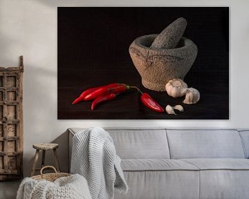 Still life of a      Still life of an Indonesian mortar with red peppers and garlic against a black by Birgitte Bergman