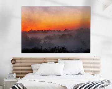 Sunrise with morning fog at a River in Africa van W. Woyke