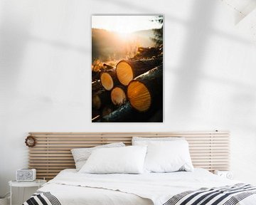 Sonnenaufgang über Holzstapeln von Poster Art Shop
