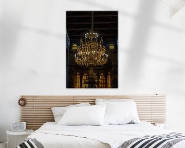 dark church and a golden chandelier by Lieve Sluijsmans