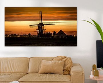 Dutch windmill at sunset 