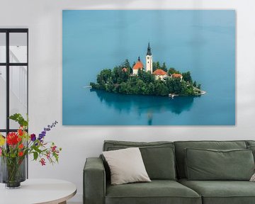 Idyllic island in turquoise lake by OCEANVOLTA