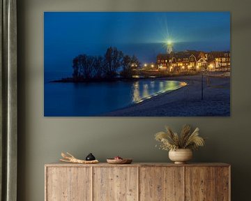 Urker lighthouse in the evening from the beach by R Smallenbroek